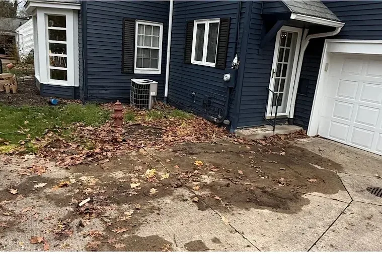 The same driveway, swept clear down to the concrete.